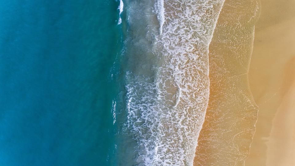 The beach and the water beyond it
